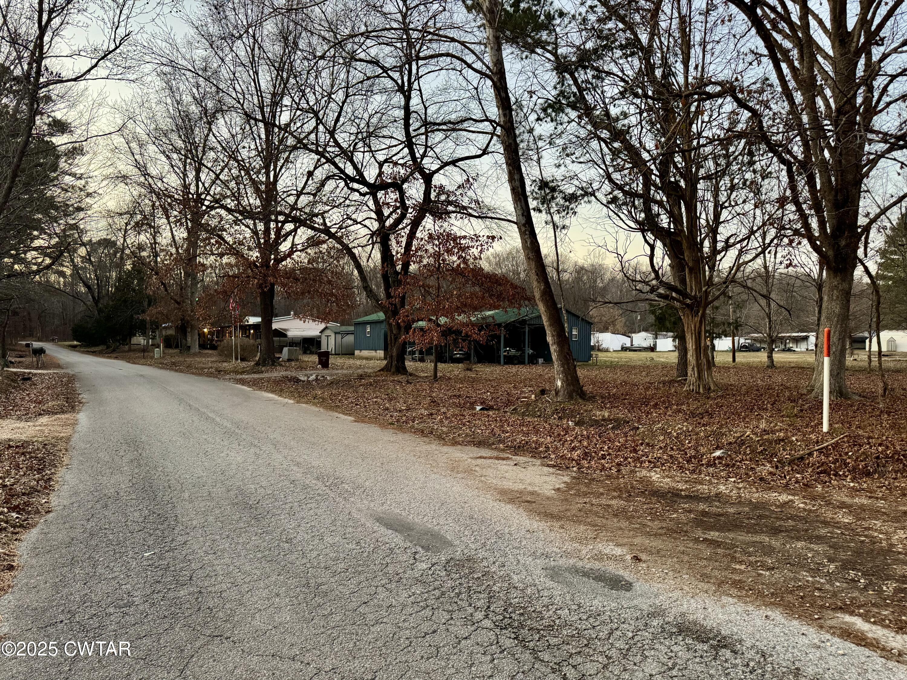 0 Sulphur Creek Road Big Sandy, TN 38221 - Photo 7 of 8 a view of road with trees