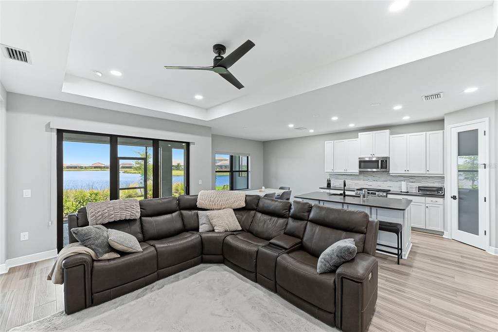 4191 Pegasus Way Naples, FL 34120 - Photo 7 of 48 a living room with furniture and a large window