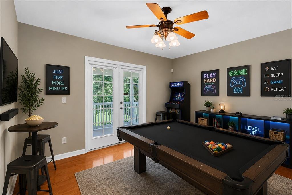 10121 Porch Street New Port Richey, FL 34655 - Photo 30 of 57 a living room with furniture and a flat screen tv