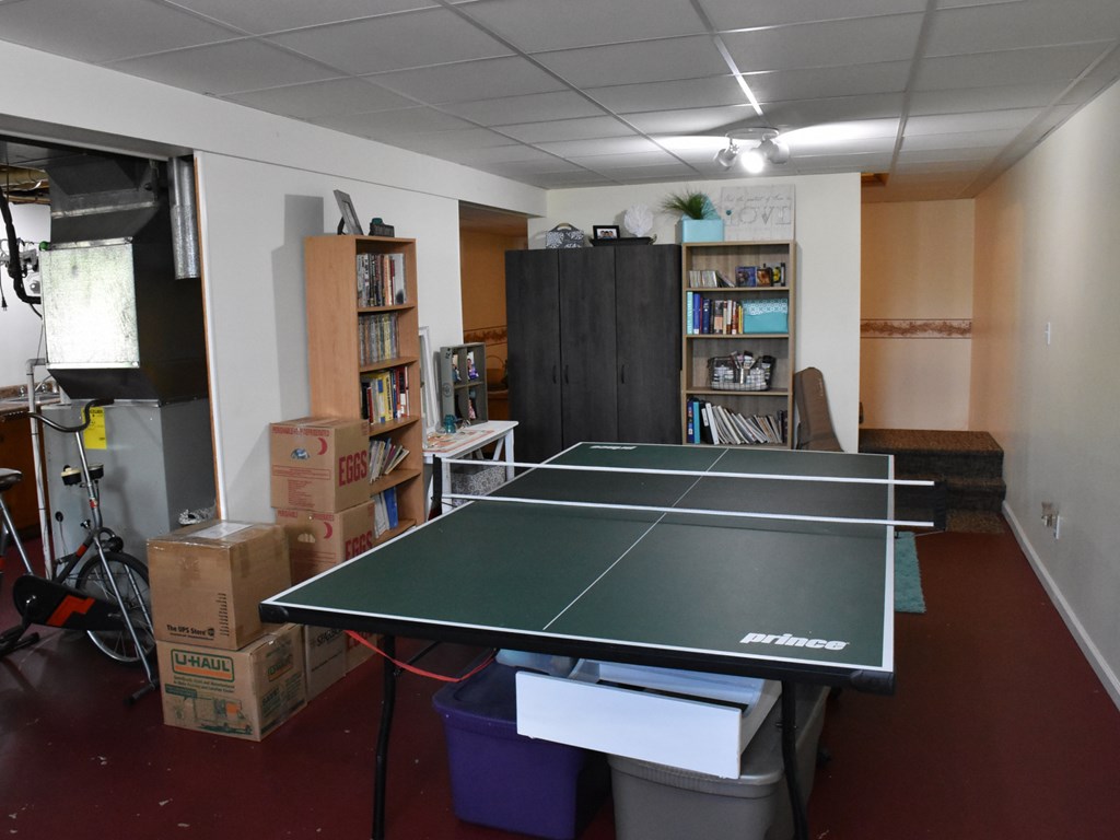 10681 Cutter Road Meadville, PA 16335 - Photo 28 of 29 a room with pool table and a bookshelf
