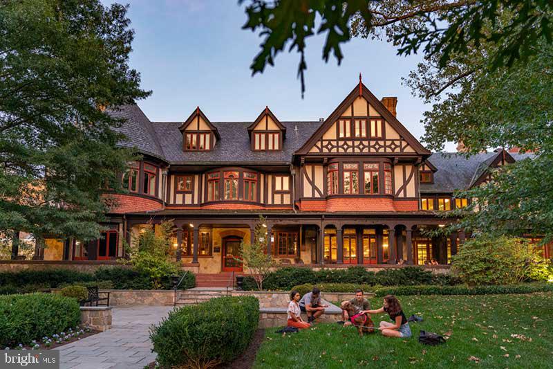 331 Rossiter Avenue Baltimore, MD 21212 - Photo 27 of 28 a front view of a residential apartment building with a yard and potted plants