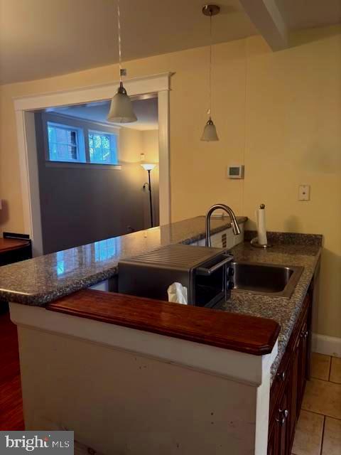 331 Rossiter Avenue Baltimore, MD 21212 - Photo 4 of 28 a kitchen with a sink and a refrigerator