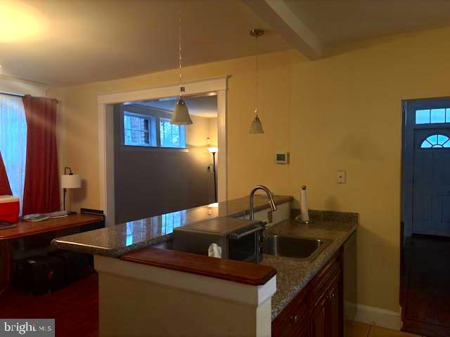 331 Rossiter Avenue Baltimore, MD 21212 - Photo 6 of 28 a bathroom with a sink and a mirror