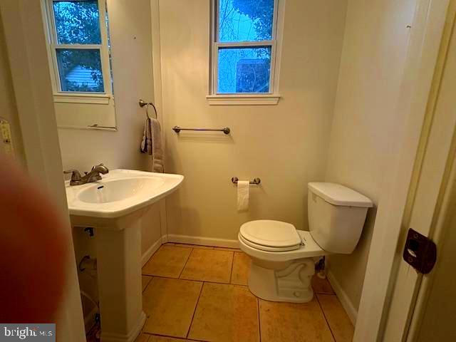 331 Rossiter Avenue Baltimore, MD 21212 - Photo 8 of 28 a bathroom with a sink and a toilet