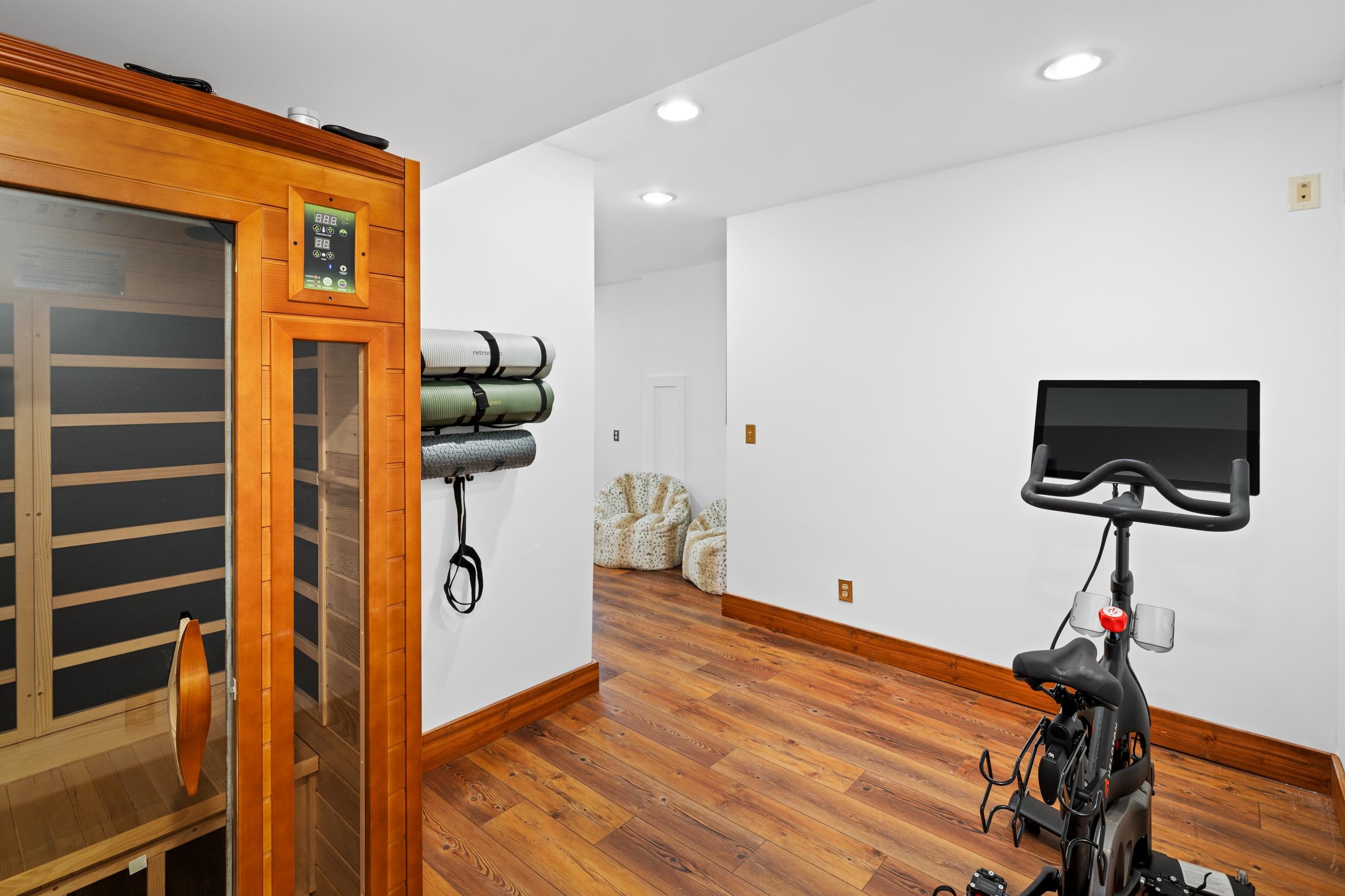 307 CC Road Madison, VA 22727 - Photo 14 of 26 a hallway with a computer on a desk and wooden floor