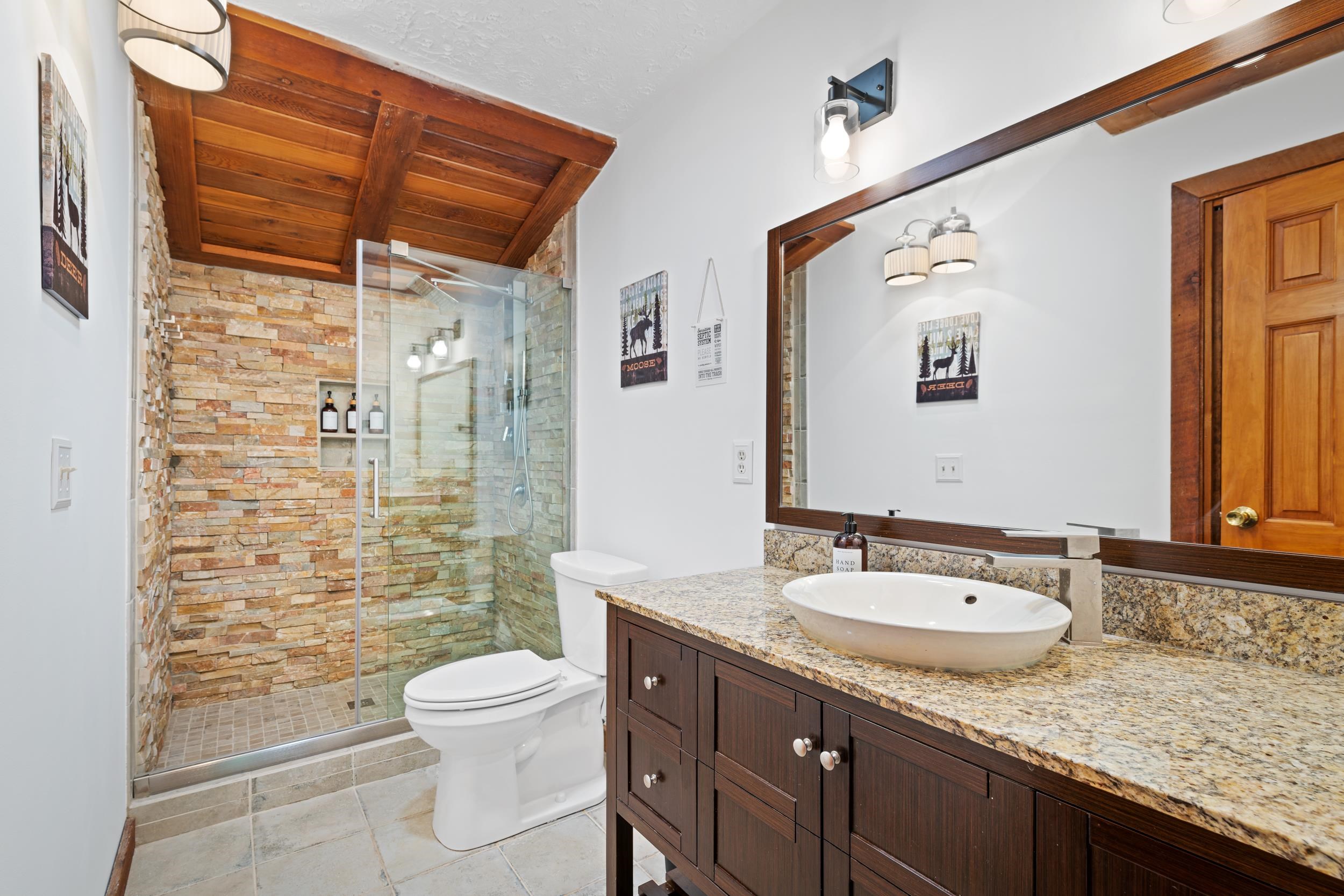 307 CC Road Madison, VA 22727 - Photo 21 of 26 a bathroom with a granite countertop sink toilet and shower