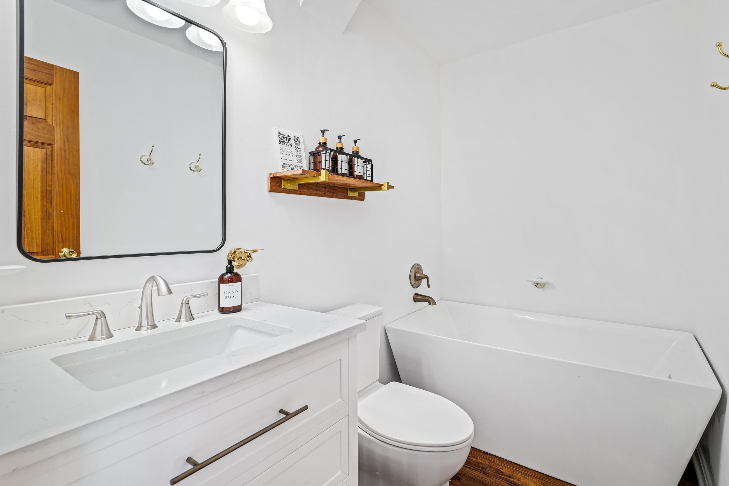 307 CC Road Madison, VA 22727 - Photo 10 of 26 a bathroom with a sink mirror vanity and toilet