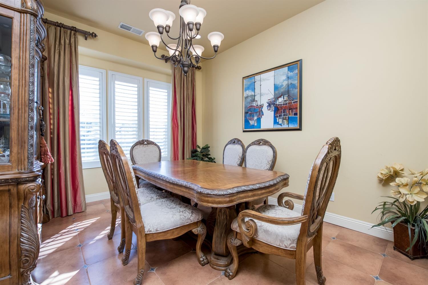 50070 Butterfield Stage Road O'Neals, CA 93645 - Photo 9 of 55 Formal dining room with plantation shutters and custom lighting