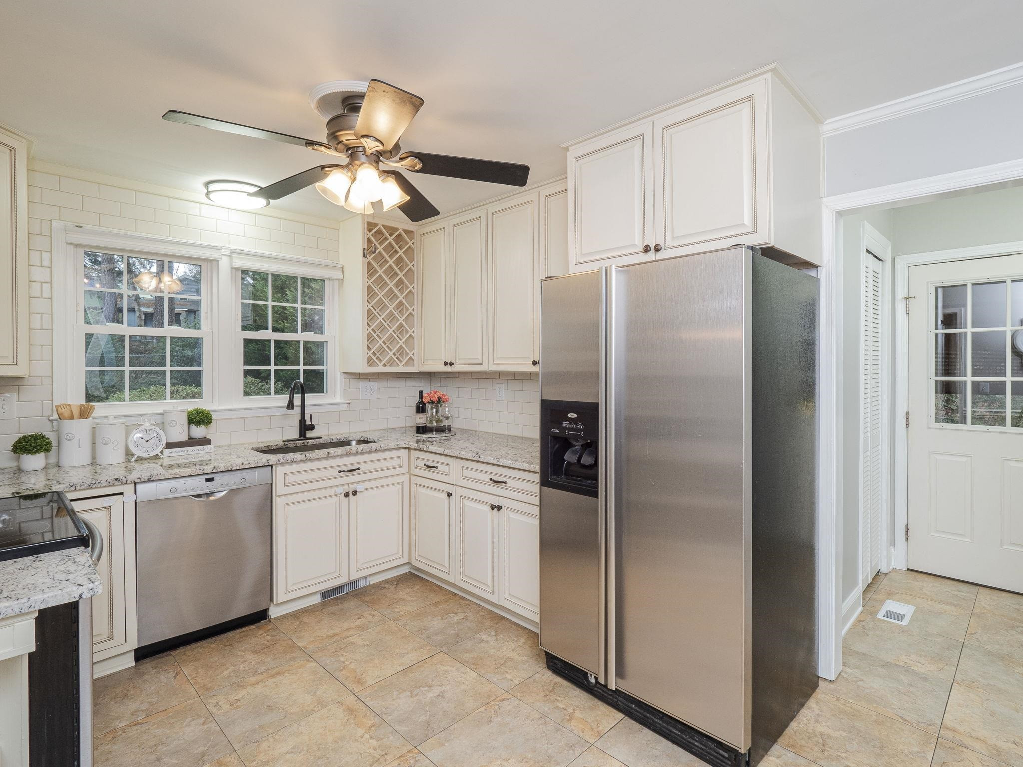 5913 Pine Tree Court Raleigh, NC 27609 - Photo 8 of 19 Updated Tile Floors & Stainless Steel Appliances! Don't miss the WINE RACK! Kitchen