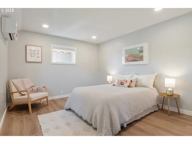 a bedroom with a bed and a chair