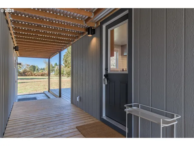 a view of entryway with wooden floor