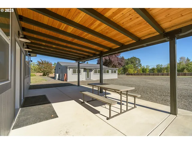 a swimming pool with outdoor seating