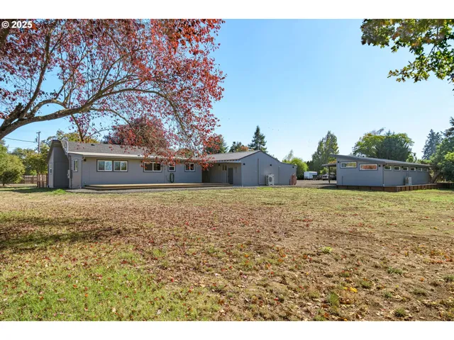 a front view of house with a garden