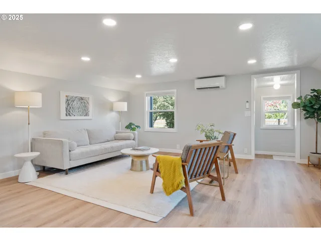 a living room with furniture and window