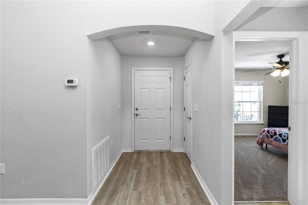 Undisclosed Address Ocala, FL 34480 - Photo 11 of 38 a view of hallway with wooden floor