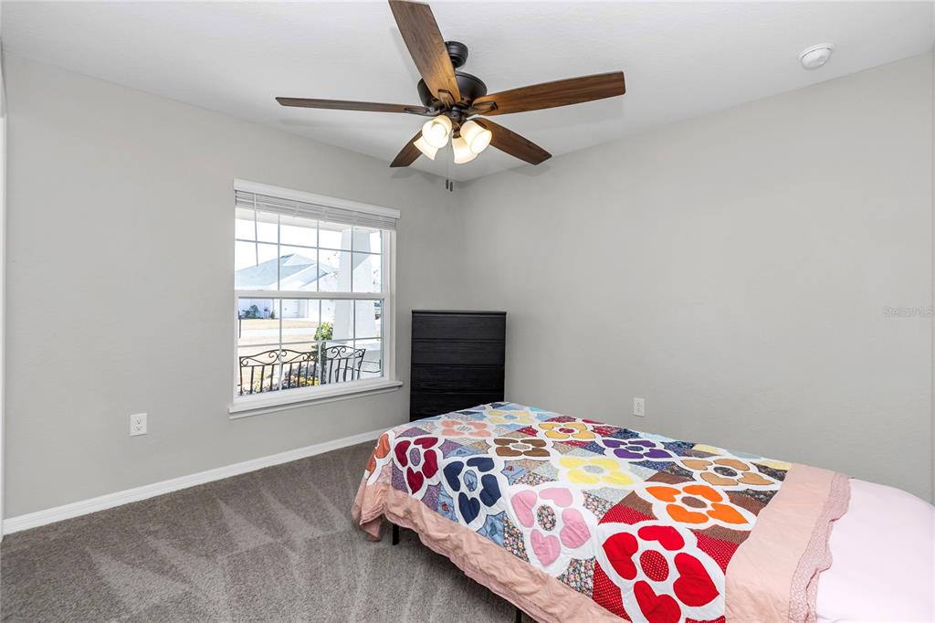 Undisclosed Address Ocala, FL 34480 - Photo 13 of 38 a bedroom with a bed and a window