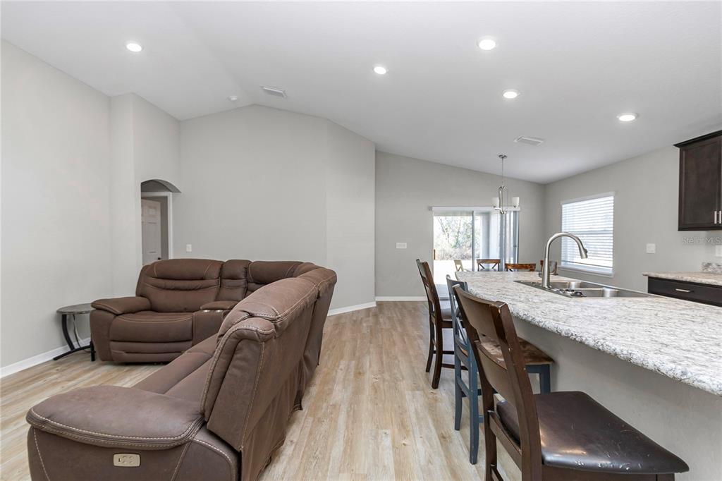 Undisclosed Address Ocala, FL 34480 - Photo 19 of 38 a living room with furniture and a wooden floor