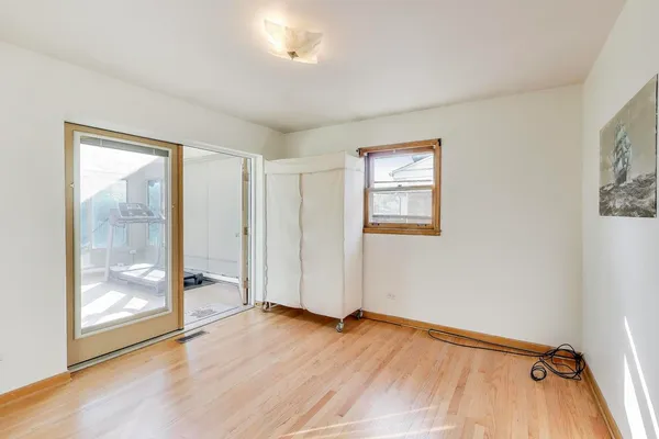 a view of an empty room with glass door