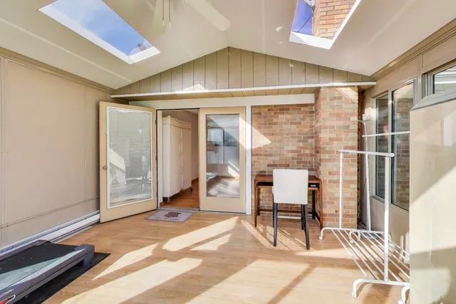 a view of a livingroom with furniture and the window