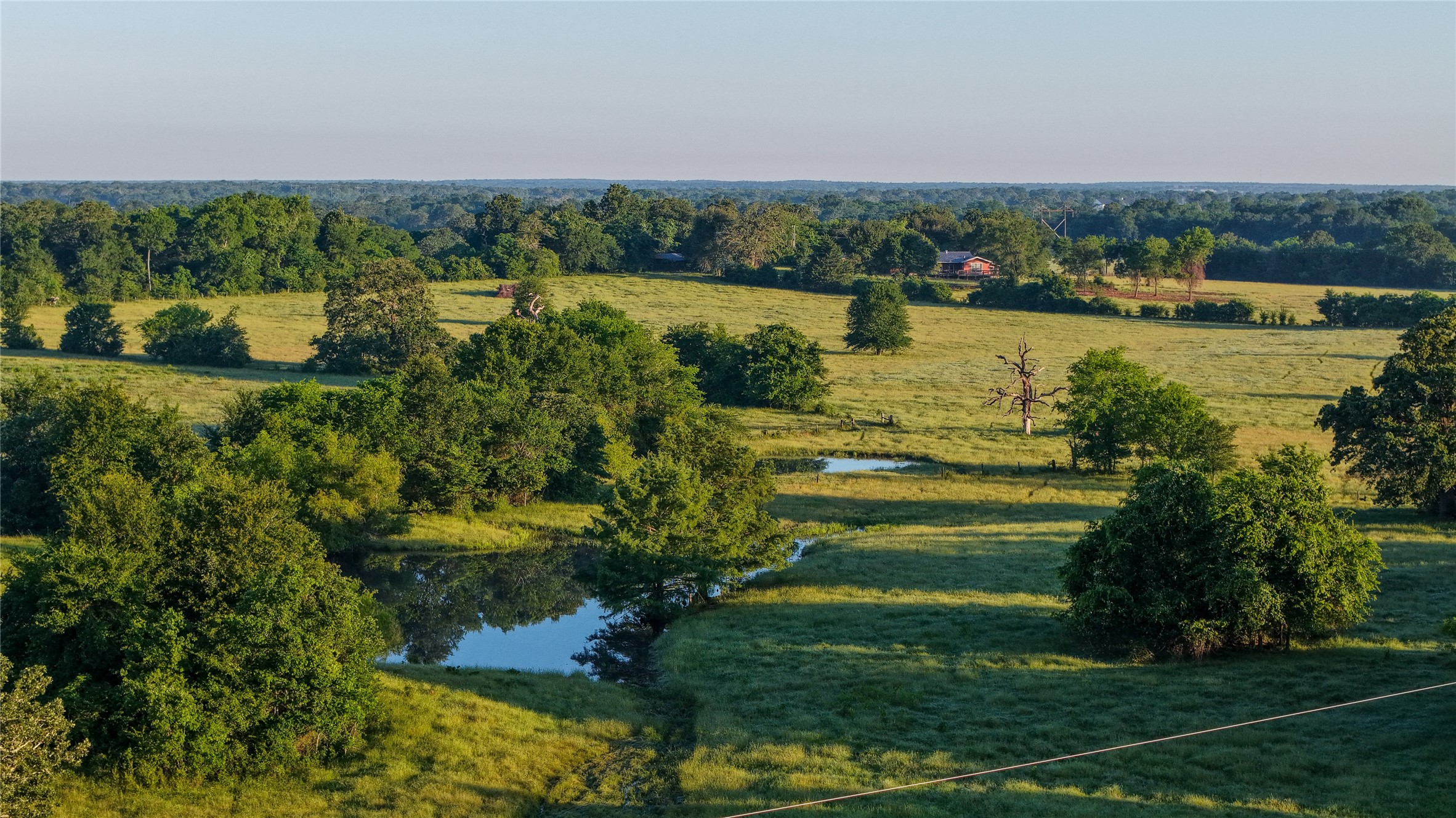 3765 Poteet Road Normangee, TX 77871 - Photo 6 of 37 a view of a lake with a city view