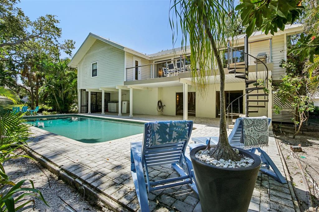 3390 Bayou Sound Longboat Key, FL 34228 - Photo 3 of 59 a view of a house with backyard and sitting area