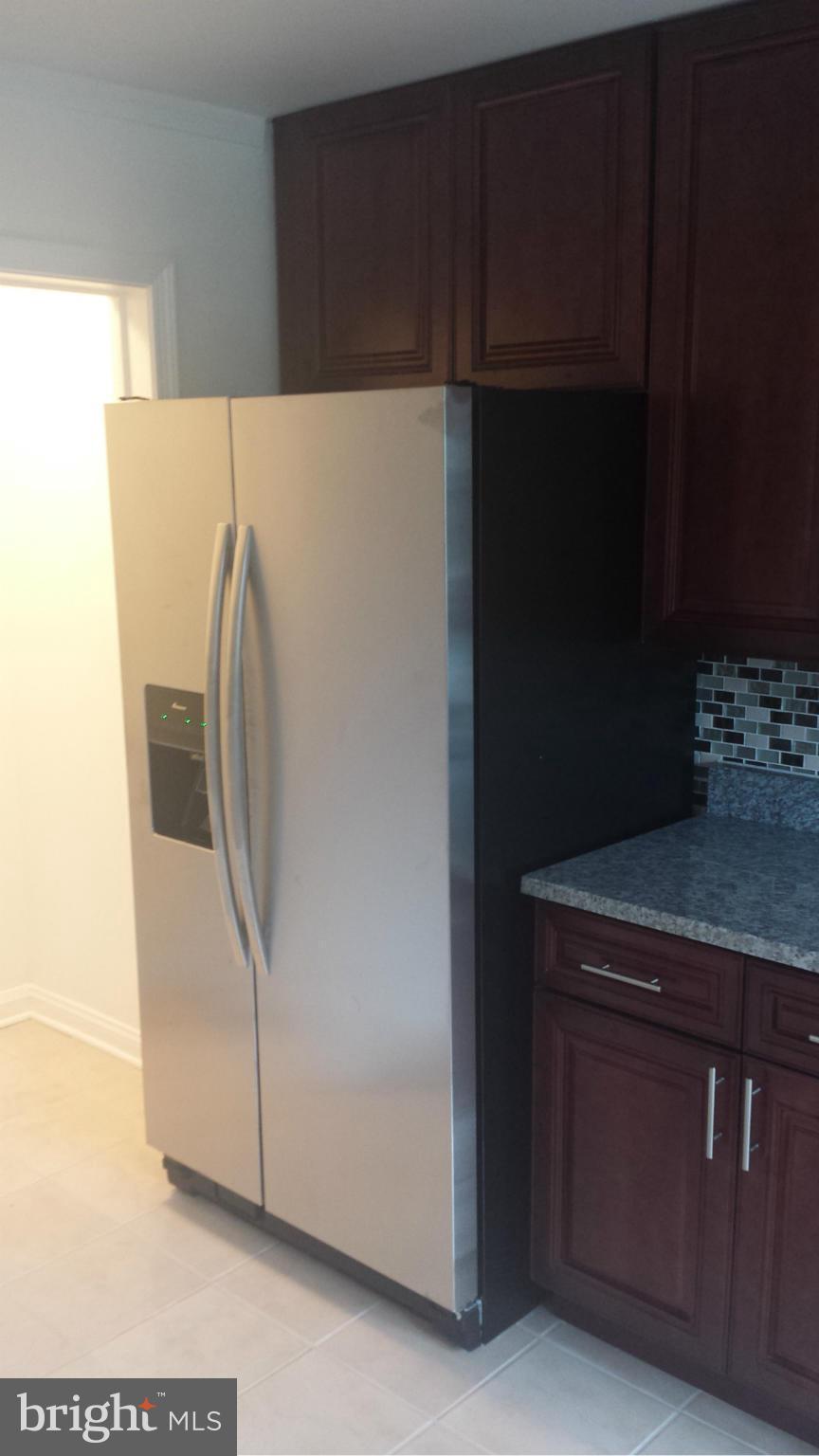 1560 Clairidge Road Baltimore, MD 21207 - Photo 9 of 16 a white refrigerator freezer sitting inside of a kitchen