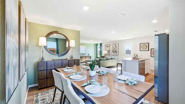 a view of a livingroom with furniture and a mirror