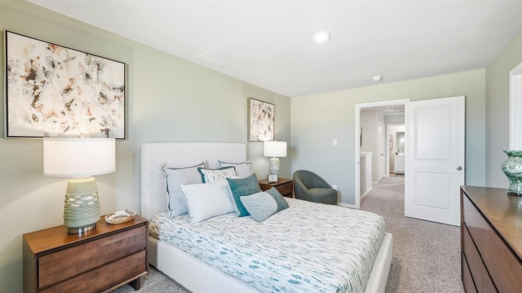 5424 Corduroy Road Krum, TX 76249 - Photo 14 of 38 a bedroom with a bed and a lamp on table