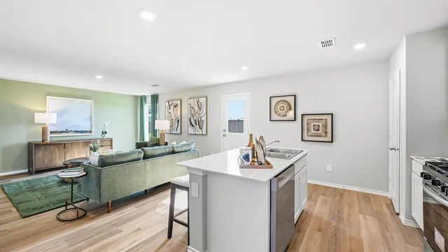 a kitchen with a stove and a sink
