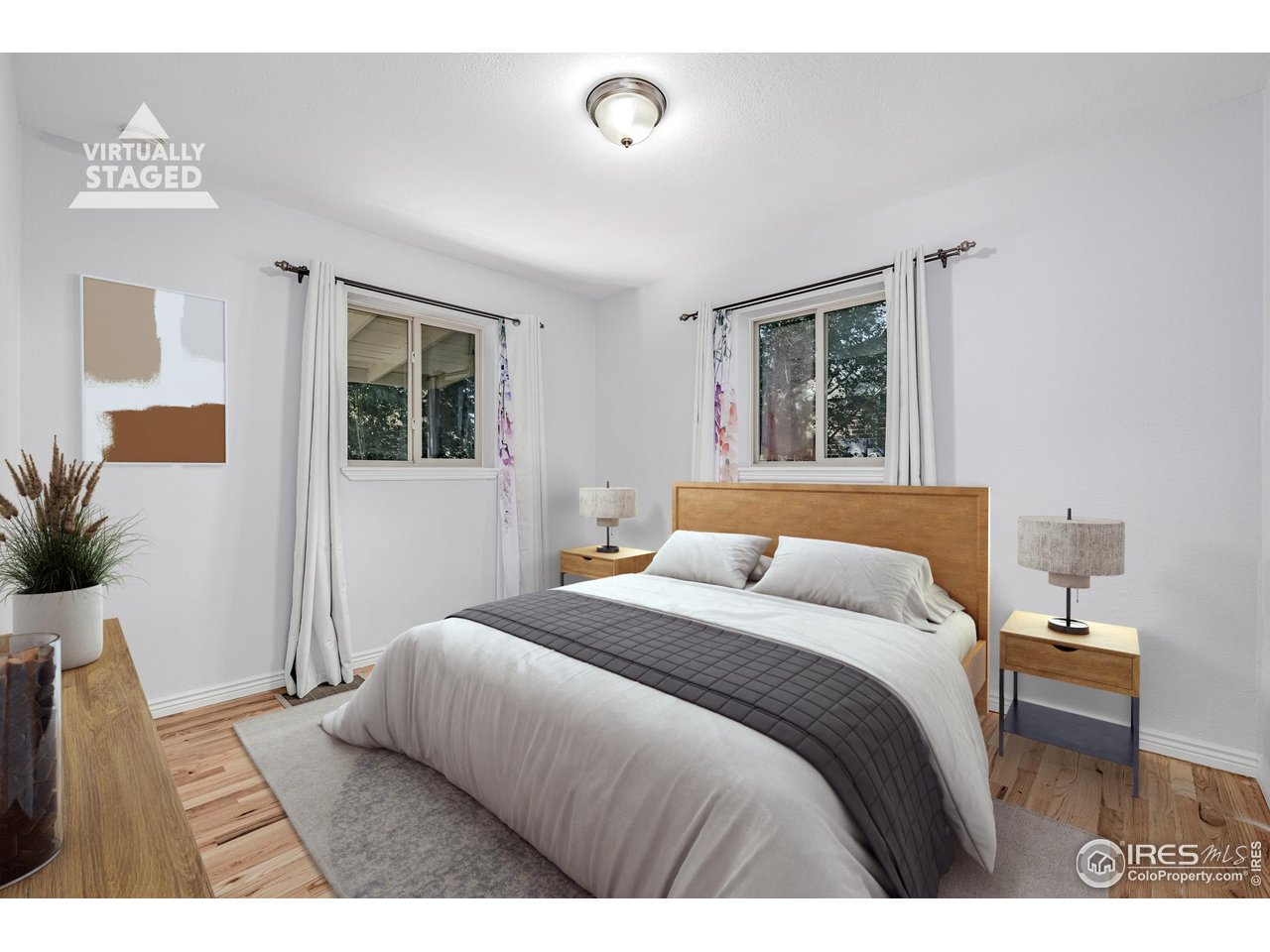 2675 Pontiac Street Denver, CO 80207 - Photo 15 of 50 a bedroom with a large bed and a window