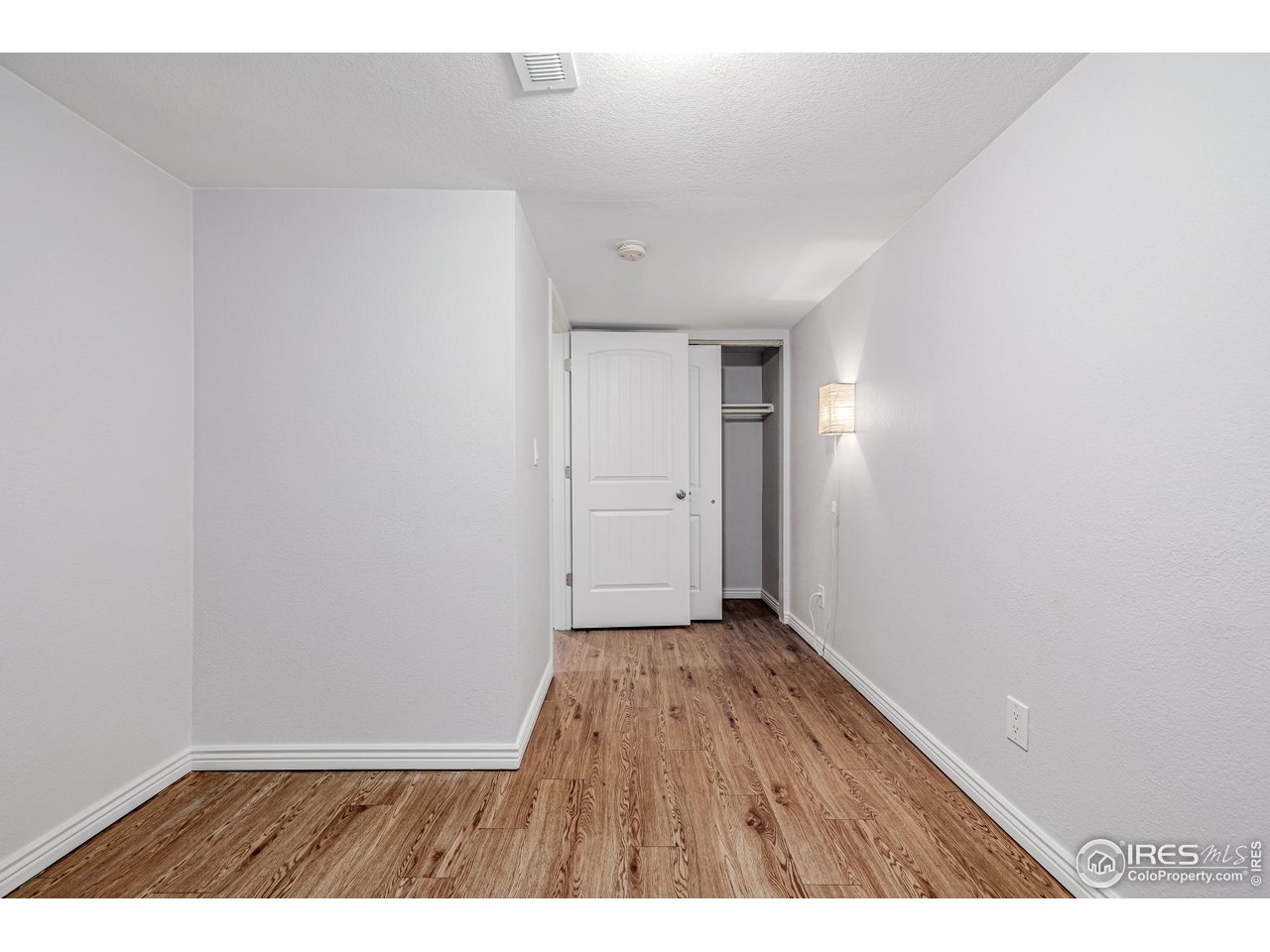 2675 Pontiac Street Denver, CO 80207 - Photo 20 of 50 a view of an empty room with wooden floor