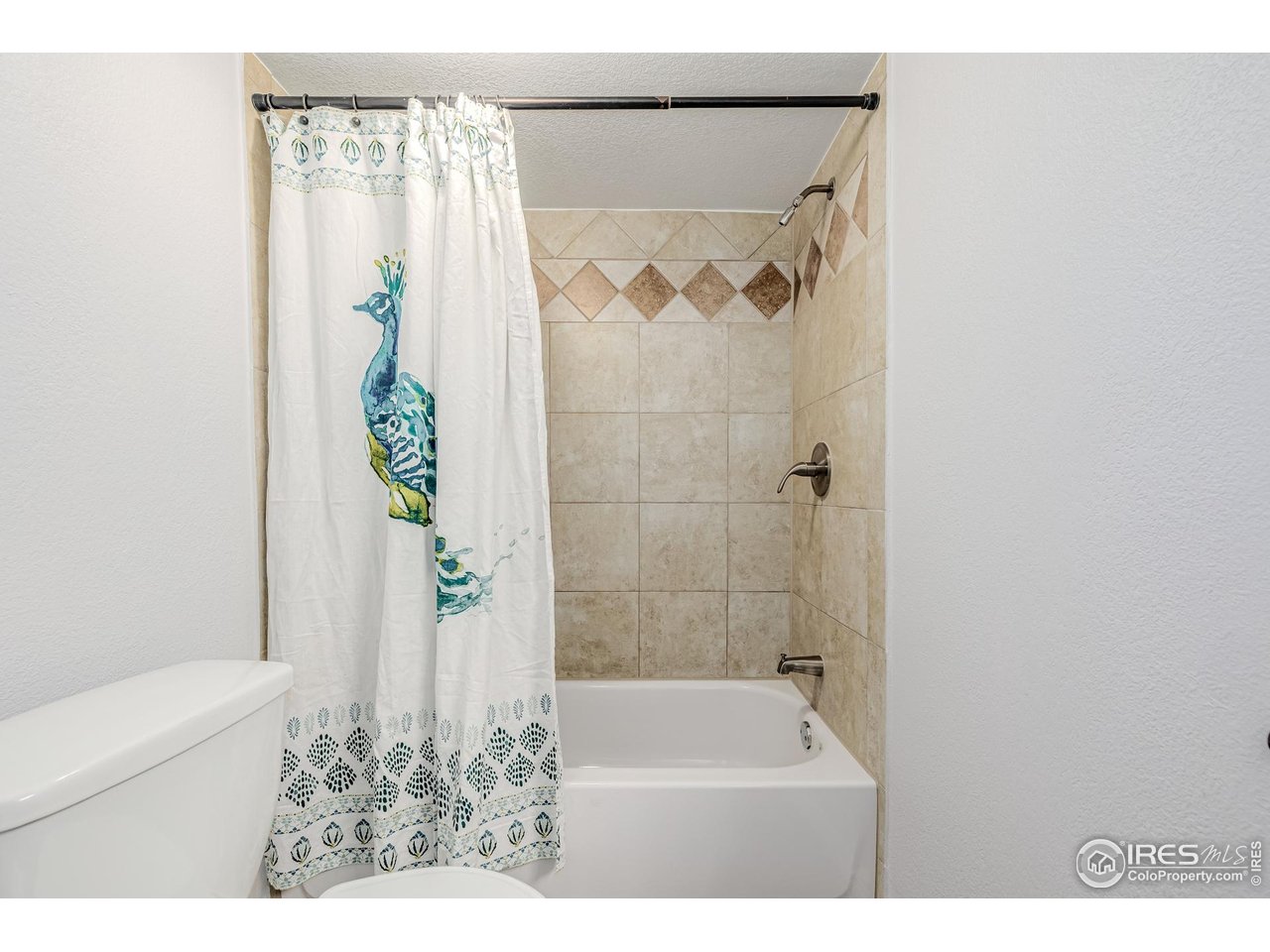 2675 Pontiac Street Denver, CO 80207 - Photo 21 of 50 a bathroom with a bathtub and shower