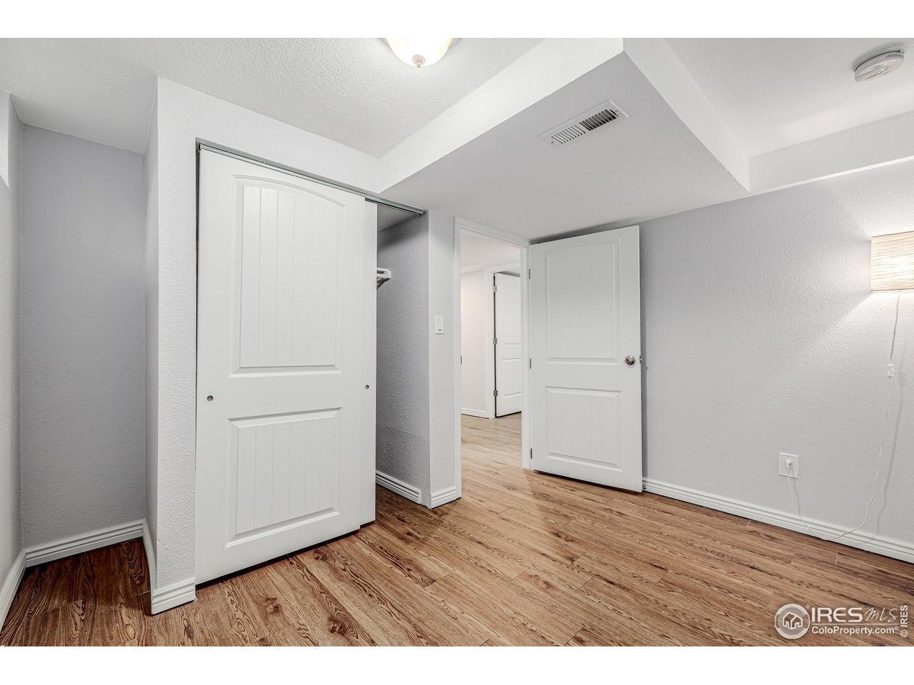 2675 Pontiac Street Denver, CO 80207 - Photo 25 of 50 a view of an empty room with wooden floor