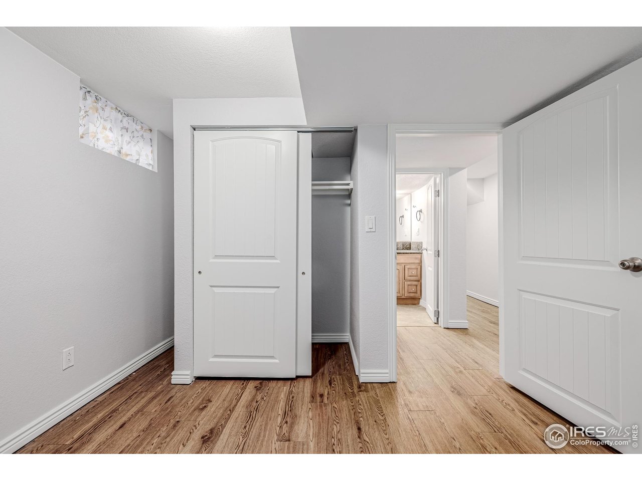 2675 Pontiac Street Denver, CO 80207 - Photo 27 of 50 a view of an empty room and wooden floor