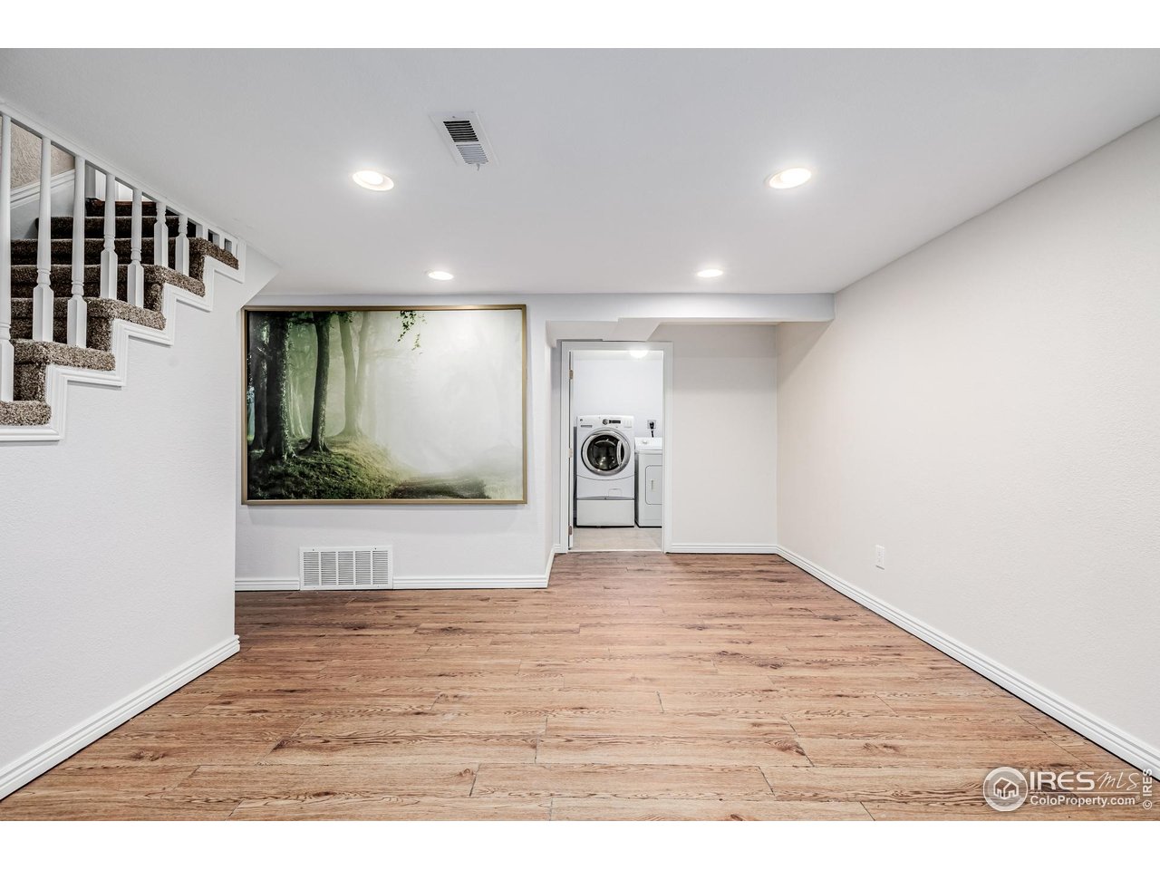 2675 Pontiac Street Denver, CO 80207 - Photo 30 of 50 a view of an empty room with wooden floor