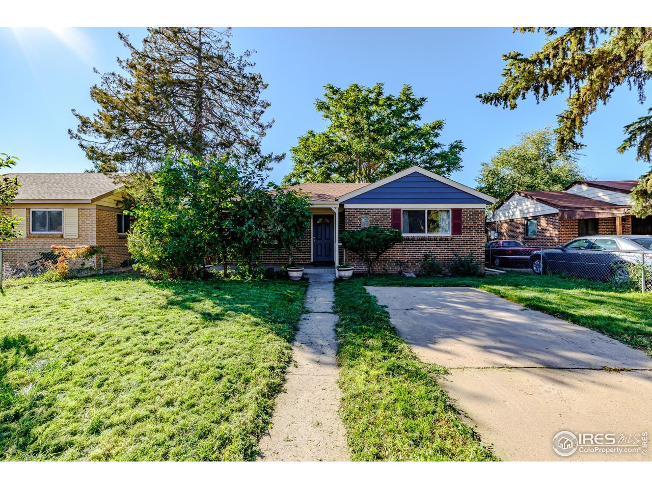 2675 Pontiac Street Denver, CO 80207 - Photo 35 of 50 a front view of a house with garden