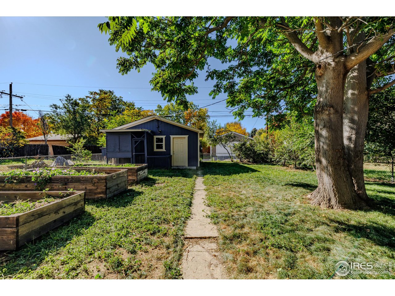 2675 Pontiac Street Denver, CO 80207 - Photo 42 of 50 a front view of a house with garden