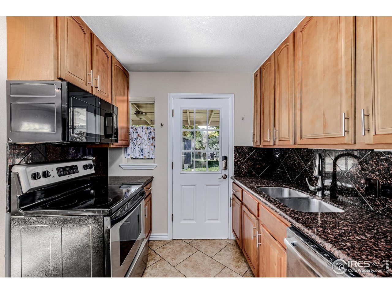 2675 Pontiac Street Denver, CO 80207 - Photo 9 of 50 a kitchen that has a sink and a stove