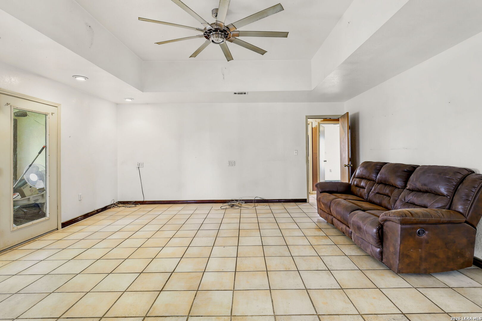 3061 Horse Ranch Road San Antonio, TX 78264 - Photo 10 of 34 a living room with a white walls and chandelier