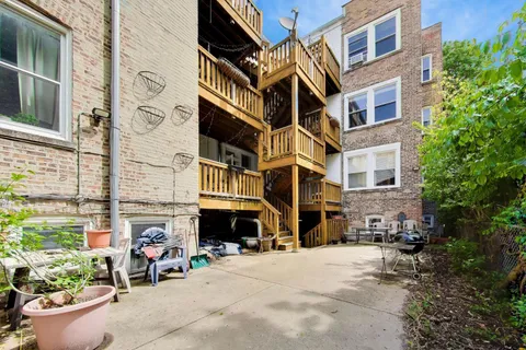 a view of a building with sitting area