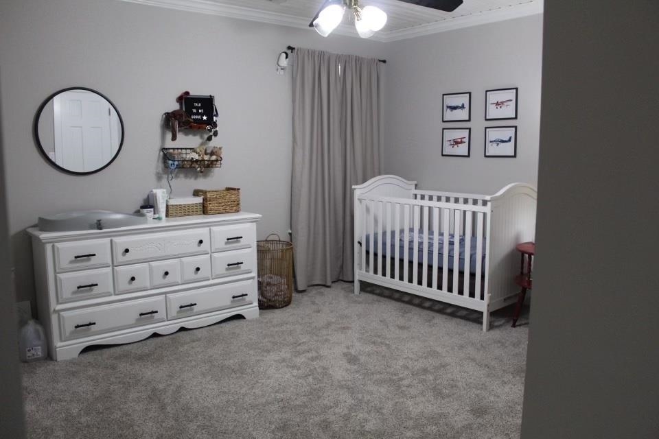 440 Stewart Road Eads, TN 38028 - Photo 19 of 25 Carpeted bedroom featuring ceiling fan, ornamental molding, and a nursery area