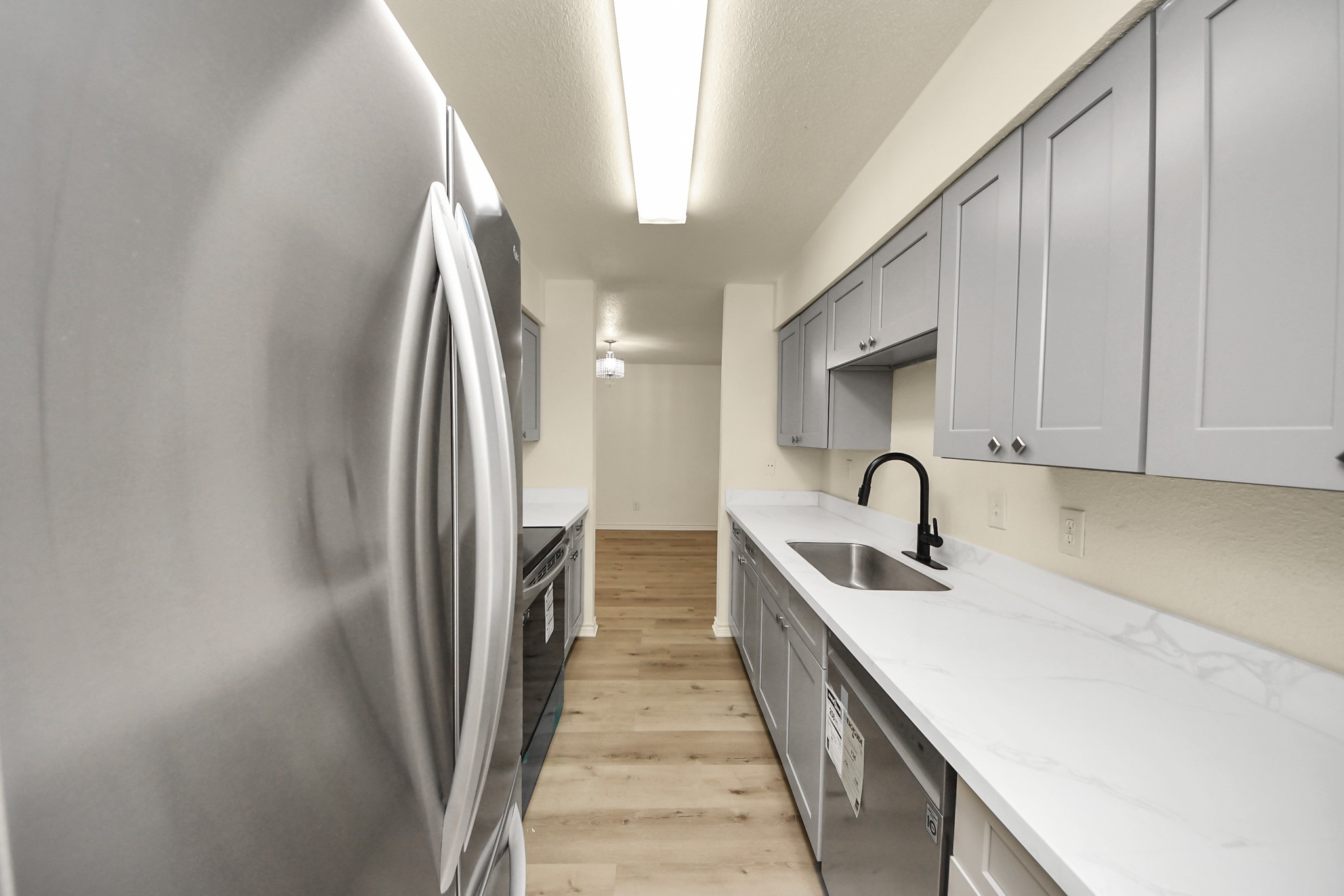 6500 Sands Point Drive, Unit 804 Houston, TX 77074 - Photo 18 of 40 a kitchen with stainless steel appliances granite countertop a sink and dishwasher