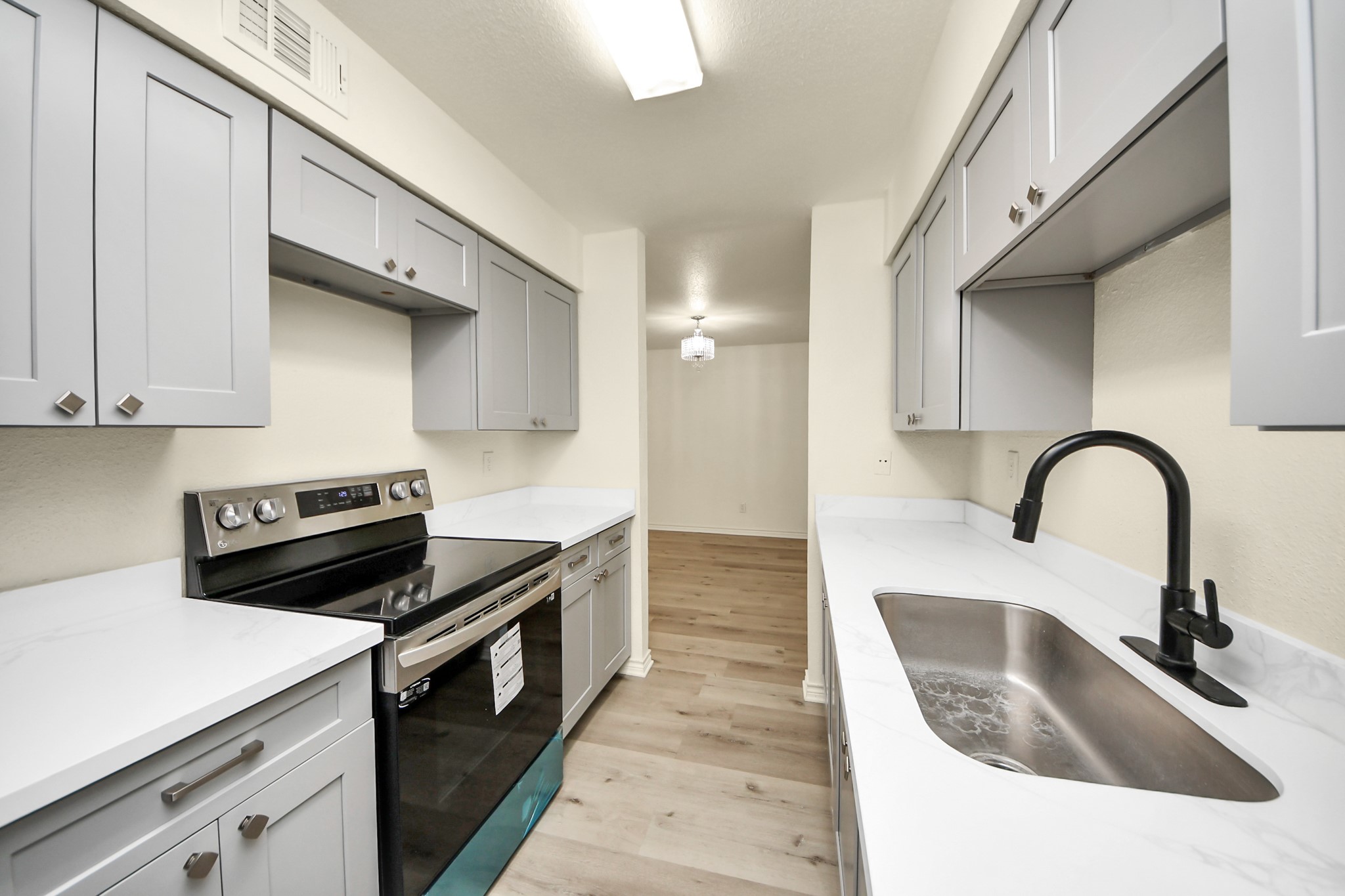 6500 Sands Point Drive, Unit 804 Houston, TX 77074 - Photo 19 of 40 a kitchen with a sink and stainless steel appliances