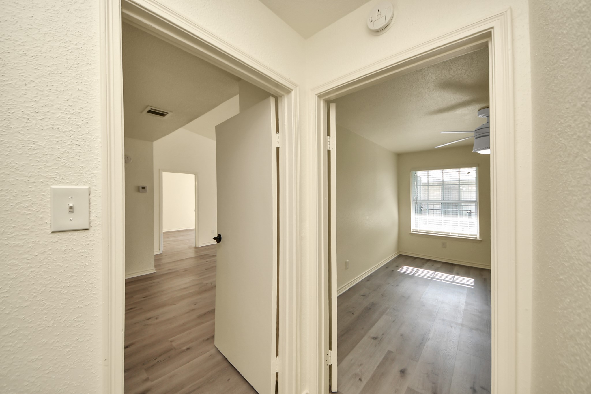 6500 Sands Point Drive, Unit 804 Houston, TX 77074 - Photo 28 of 40 a view of a hallway with wooden floor