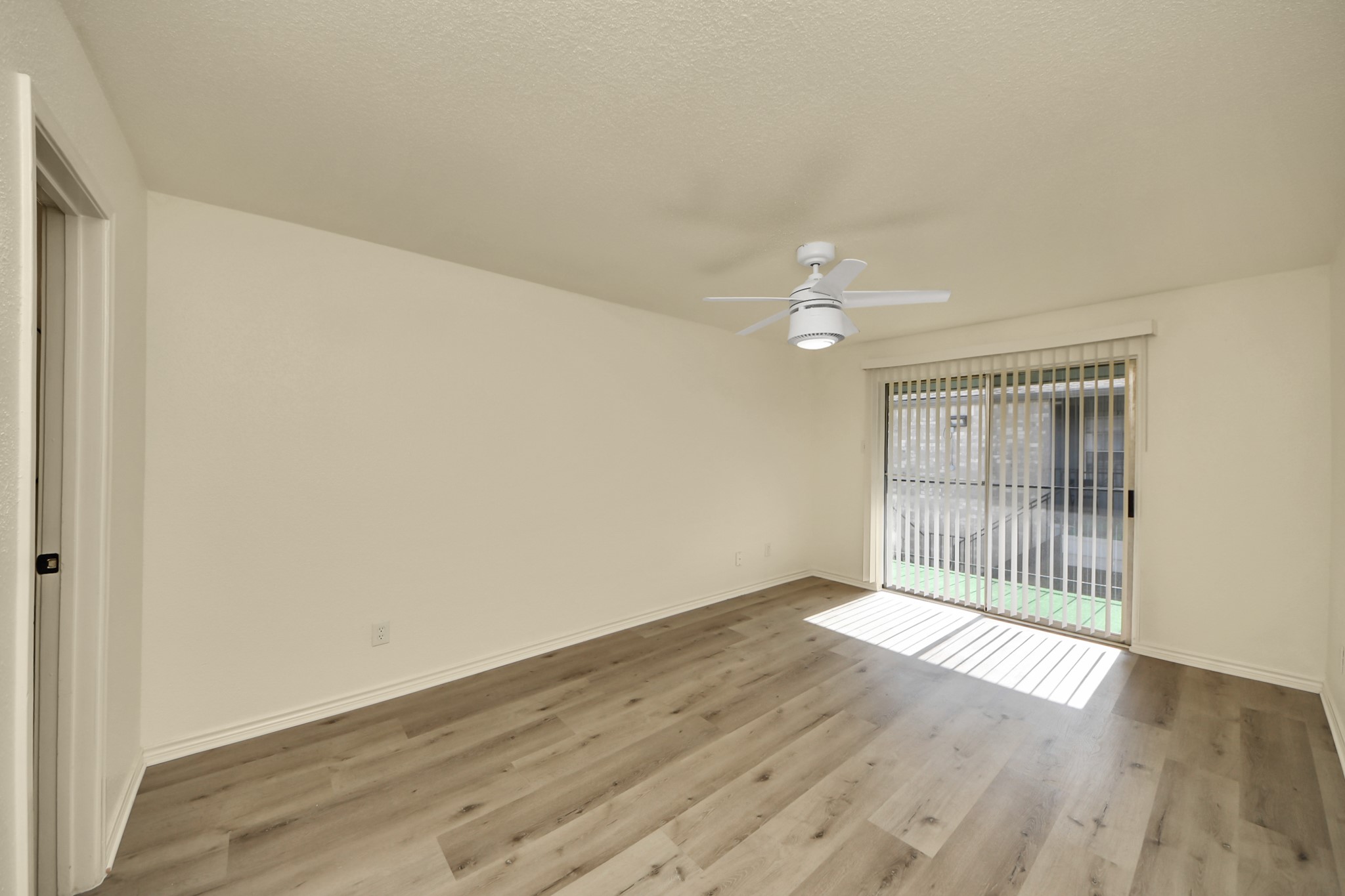 6500 Sands Point Drive, Unit 804 Houston, TX 77074 - Photo 29 of 40 wooden floor in an empty room with a window