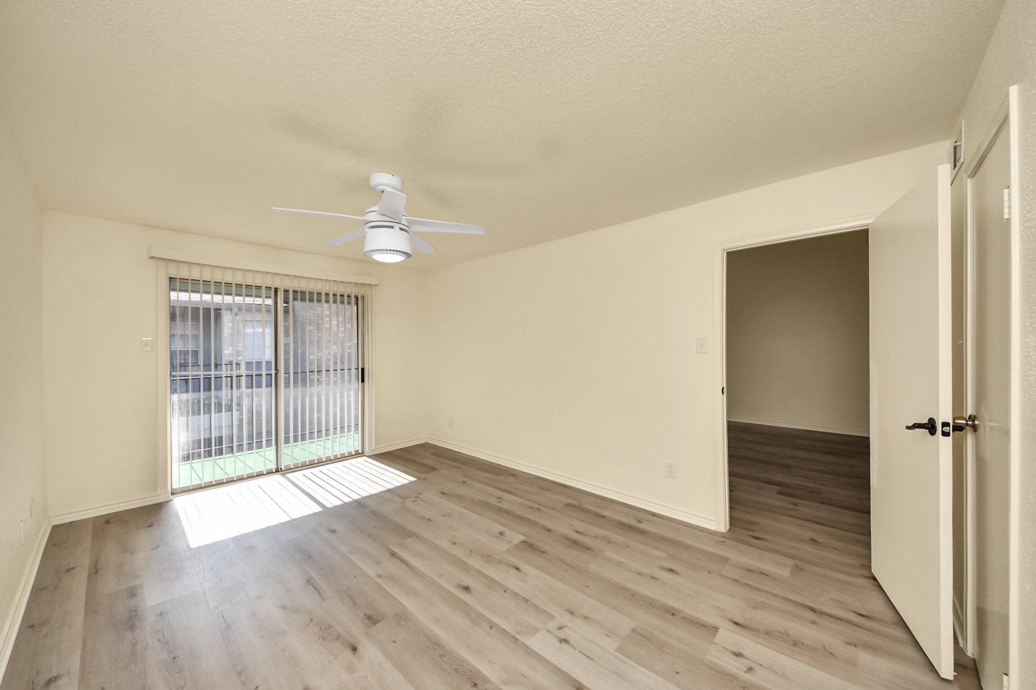 6500 Sands Point Drive, Unit 804 Houston, TX 77074 - Photo 30 of 40 wooden floor in an empty room with a window