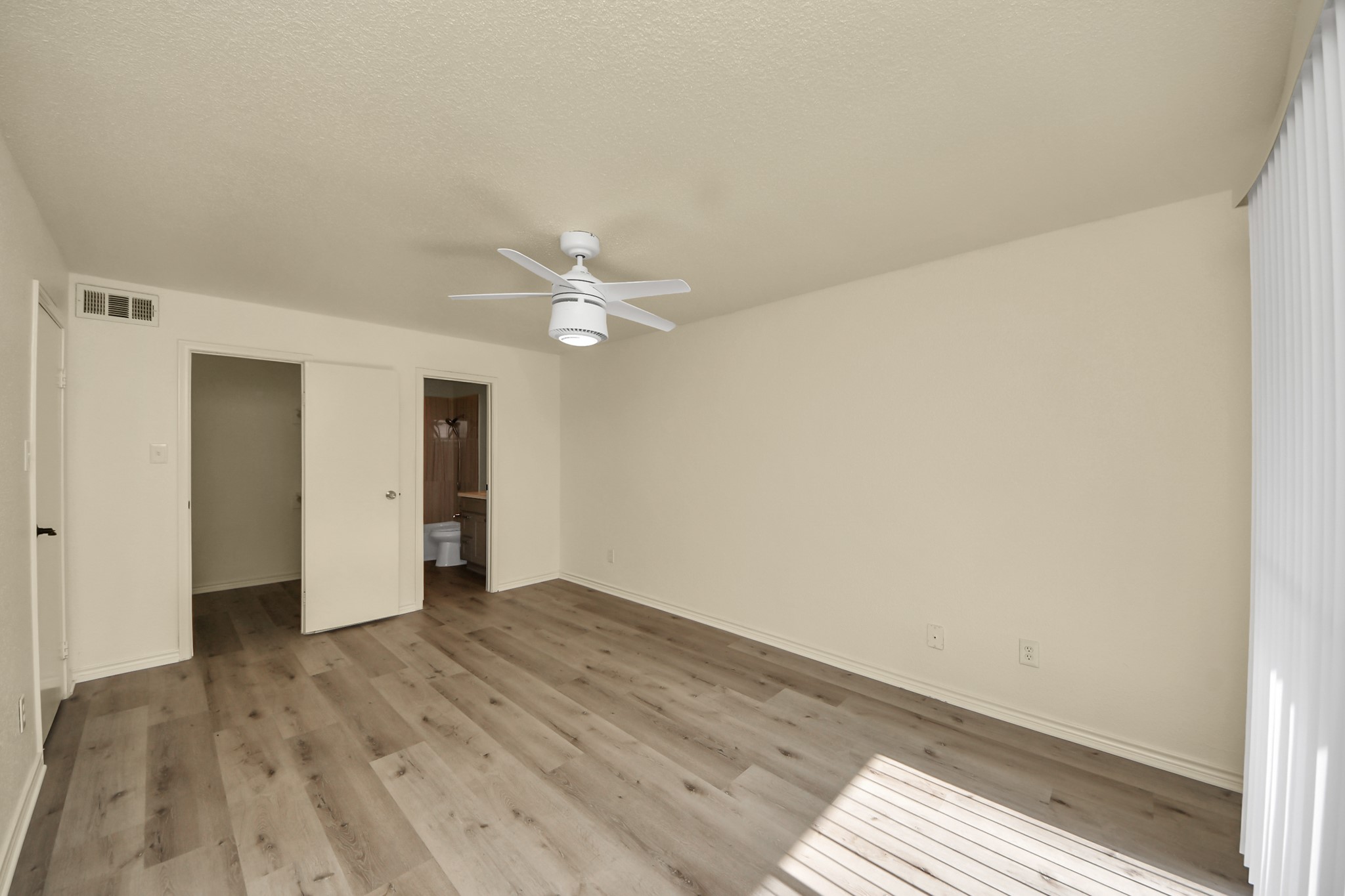 6500 Sands Point Drive, Unit 804 Houston, TX 77074 - Photo 31 of 40 a view of a room with wooden floor and white walls