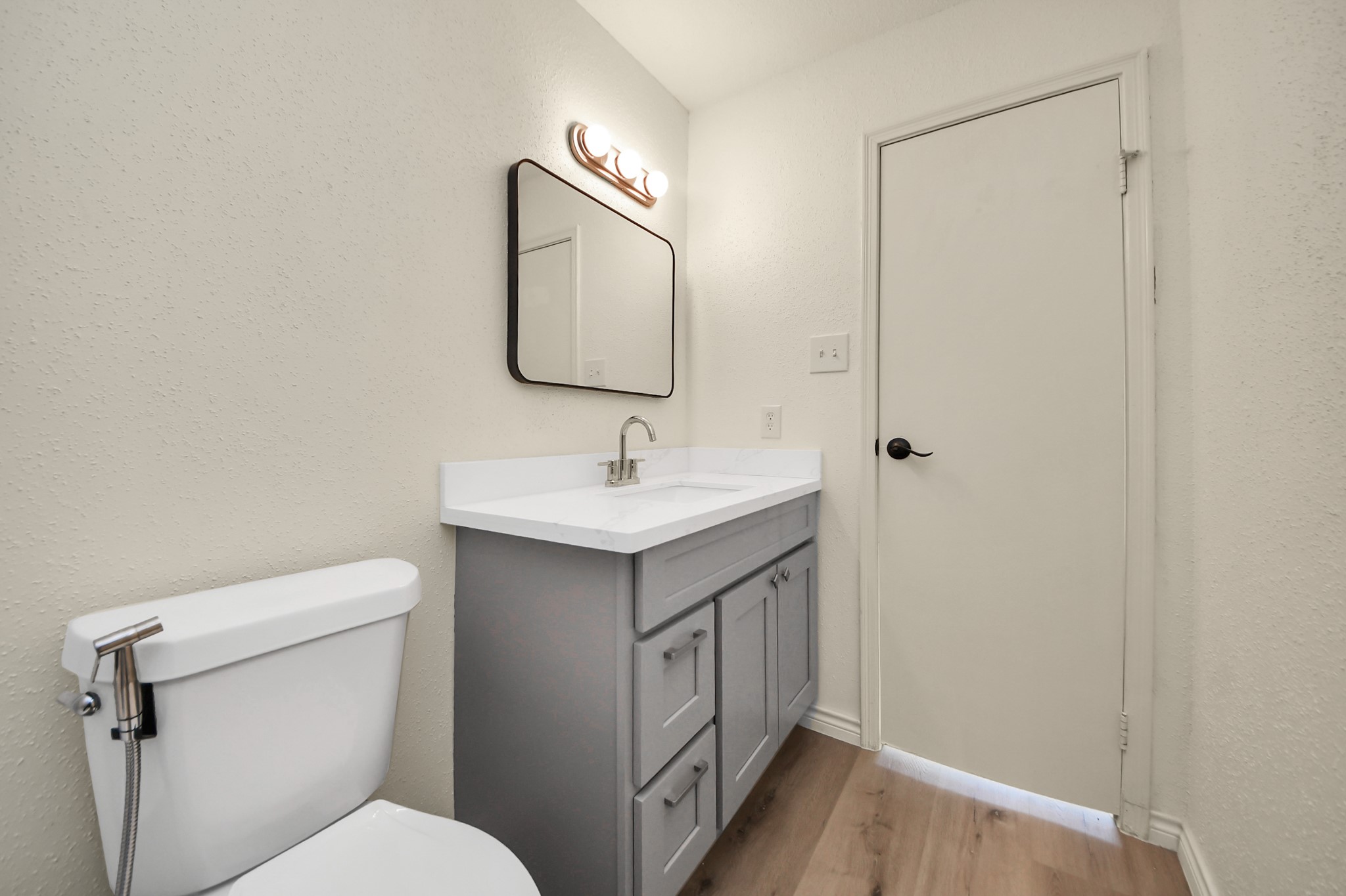 6500 Sands Point Drive, Unit 804 Houston, TX 77074 - Photo 35 of 40 a bathroom with a toilet sink and mirror