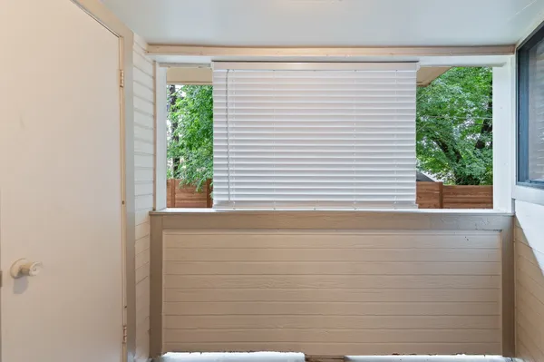 a view of a room that has a large window