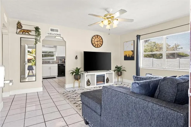a living room with furniture and a flat screen tv